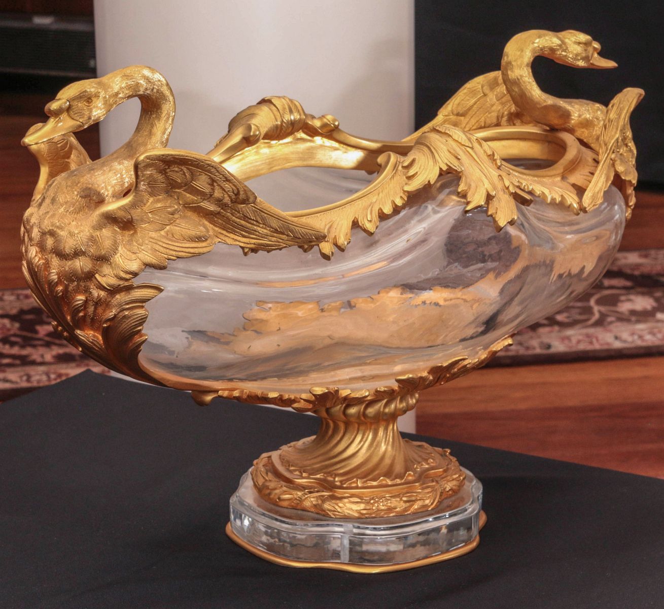 A CRYSTAL CENTERPIECE WITH BRONZE SWAN MOUNTS