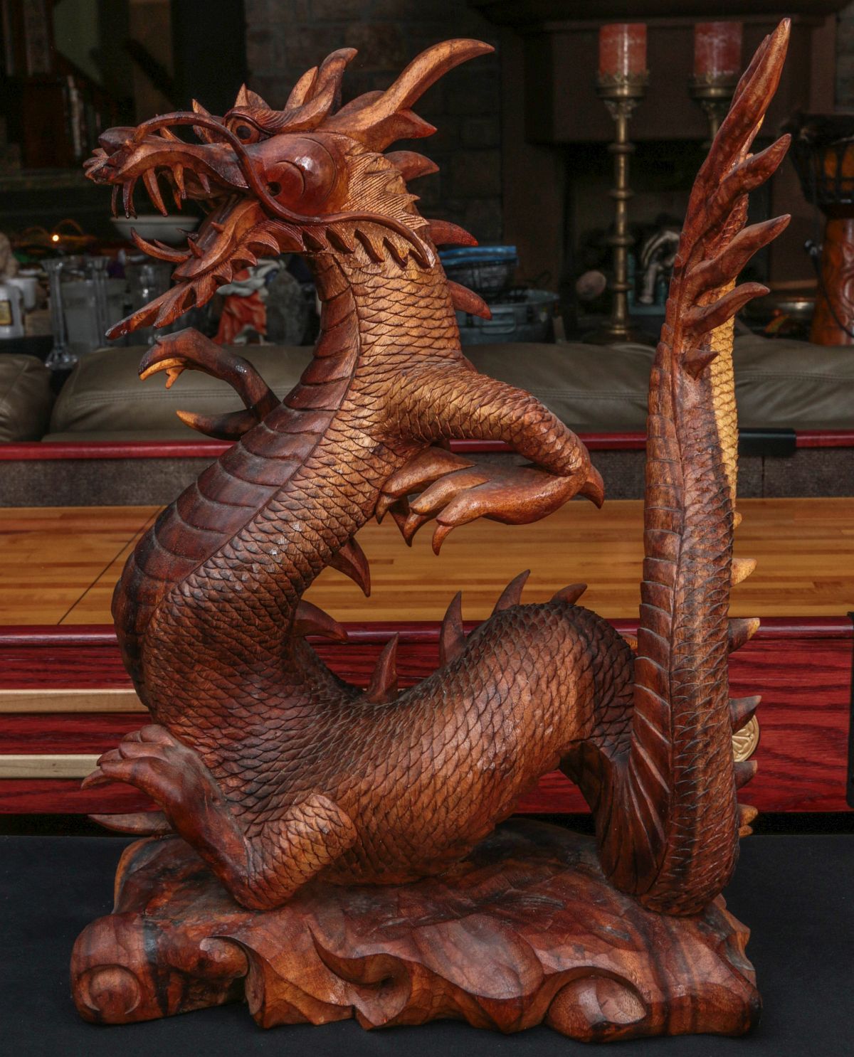 A DETAILED 23-INCH DRAGON CARVED FROM MAHOGANY