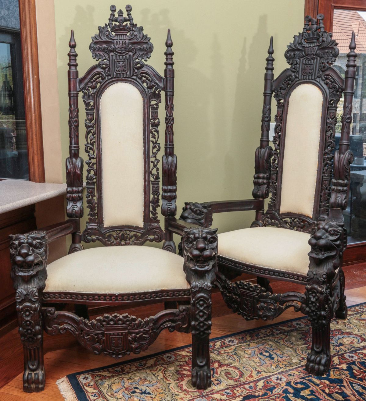 A PAIR MONUMENTAL CARVED MAHOGANY THRONE CHAIRS