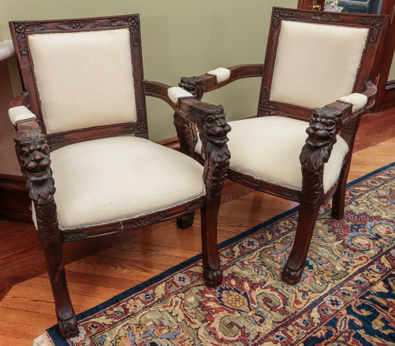 A PAIR CARVED MAHOGANY LION HEADED ARM CHAIRS
