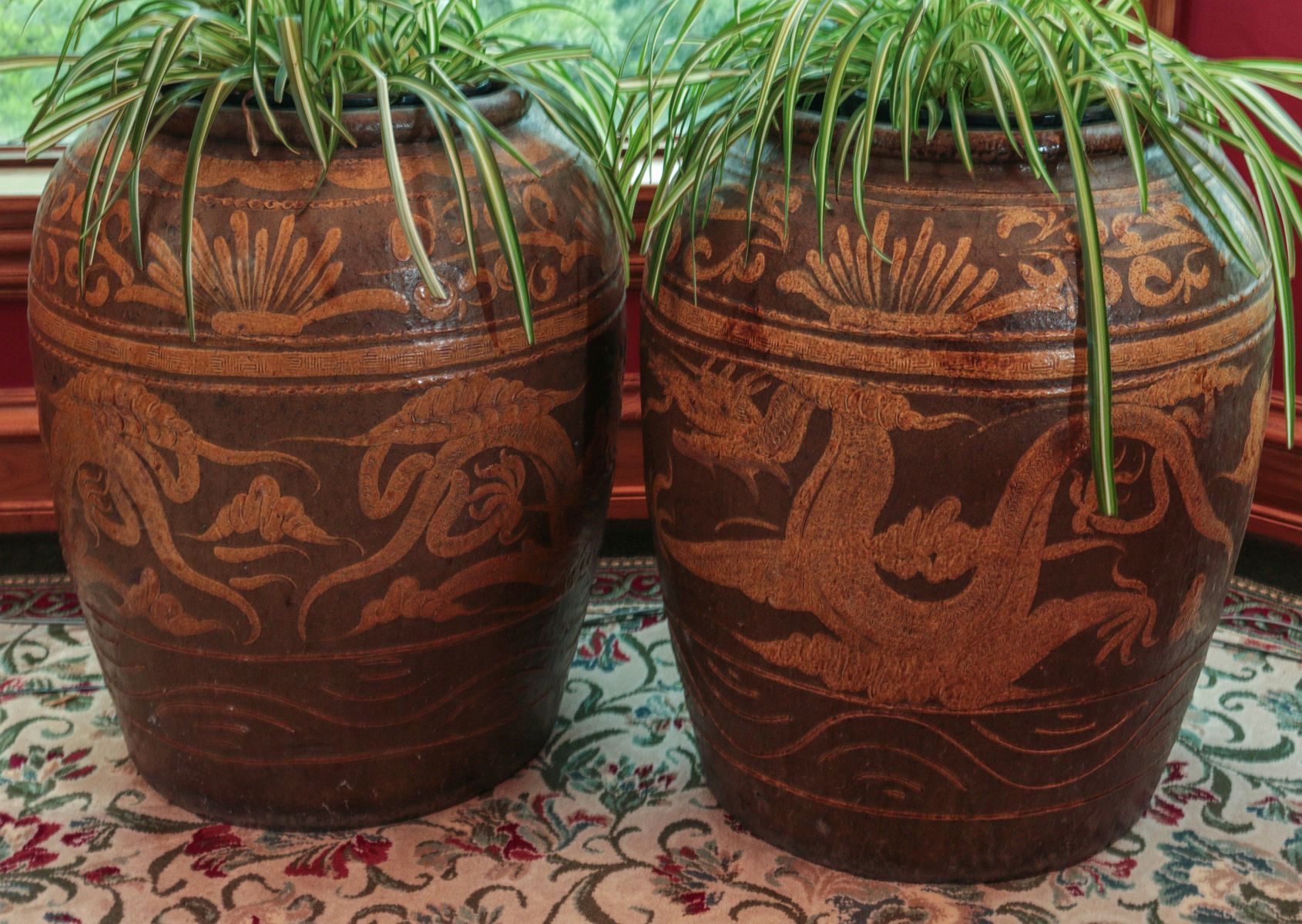 A PAIR SLIP DECORATED EARTHENWARE CHINESE VASES