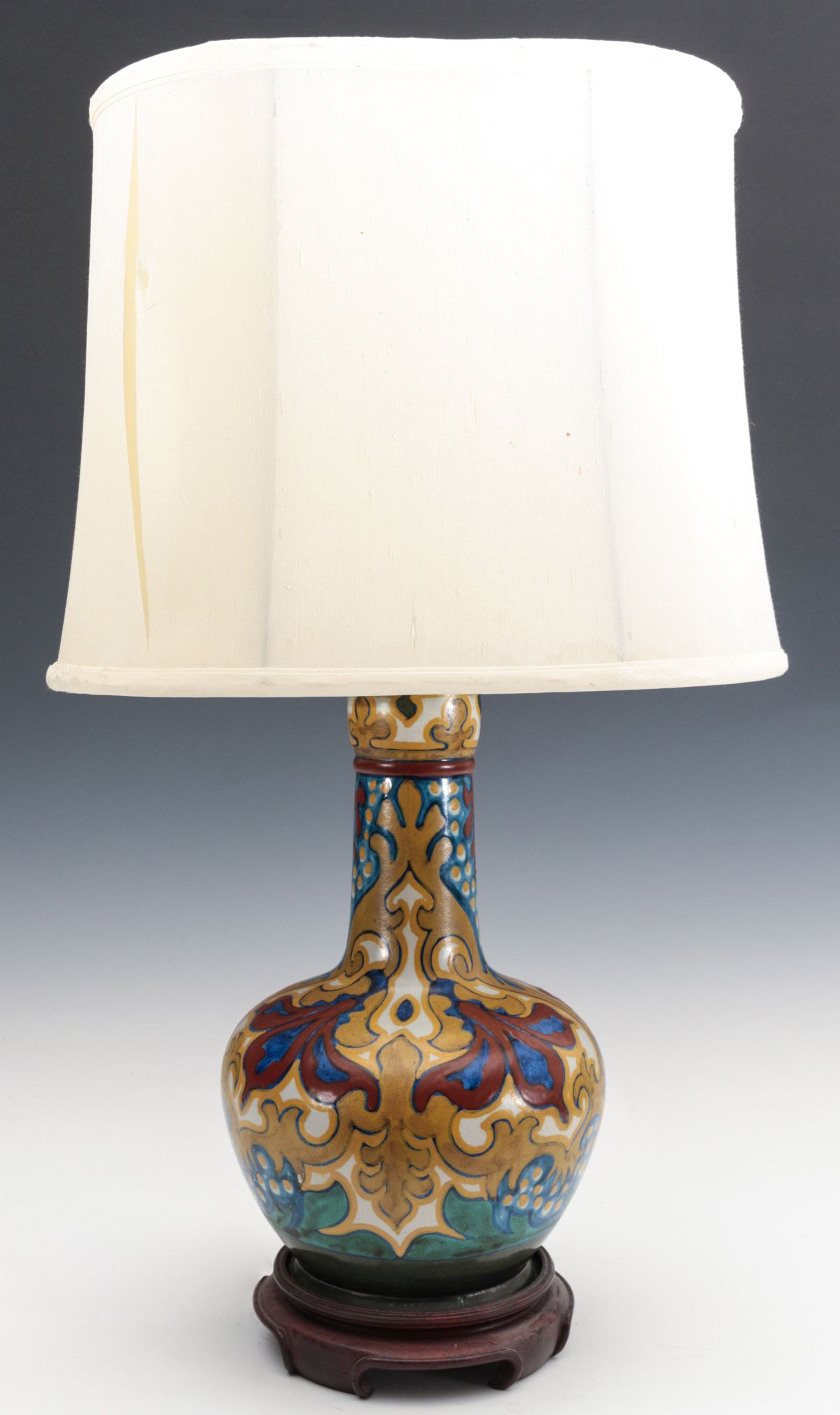 A GOUDA POTTERY BOTTLE VASE MOUNTED AS TABLE LAMP