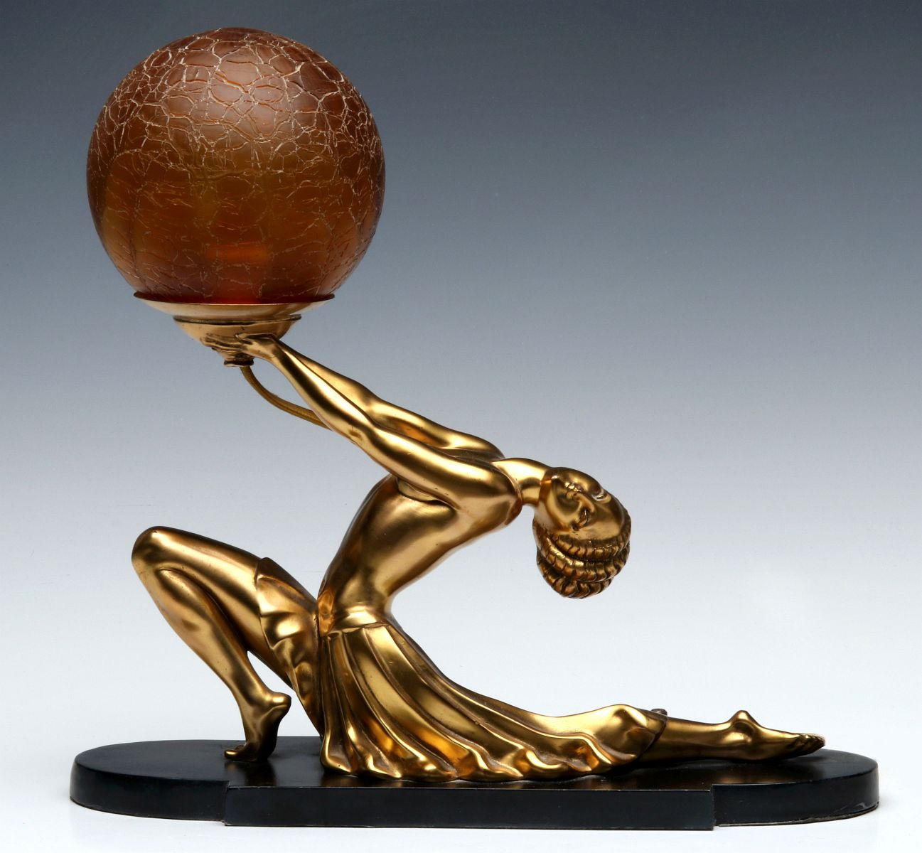 AN ART DECO FIGURAL DANCER LAMP WITH CRACKLE GLOBE