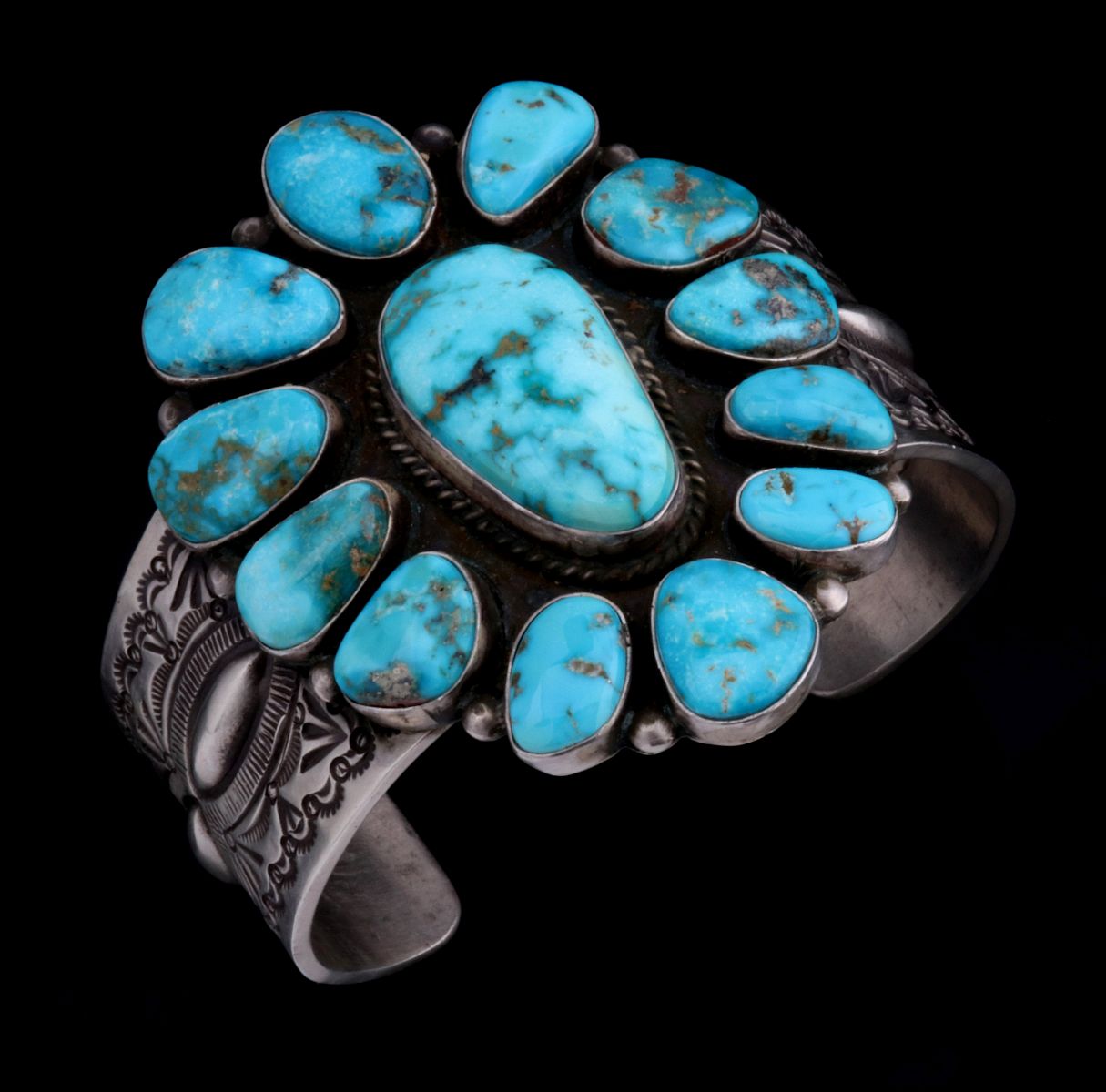 A HERMAN SMITH NAVAJO STERLING AND TURQUOISE CUFF