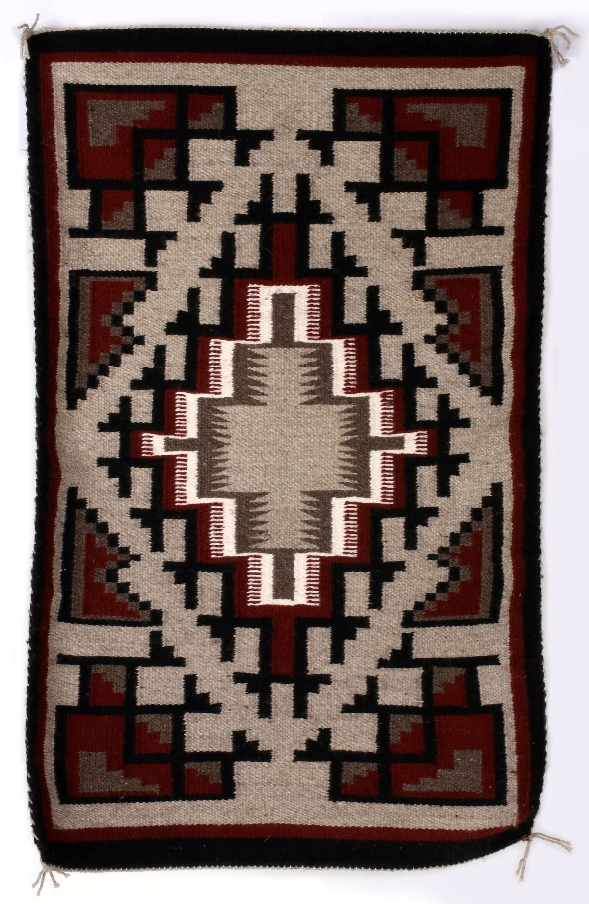 A LATE 20TH CENTURY TWO GREY HILLS NAVAJO RUG