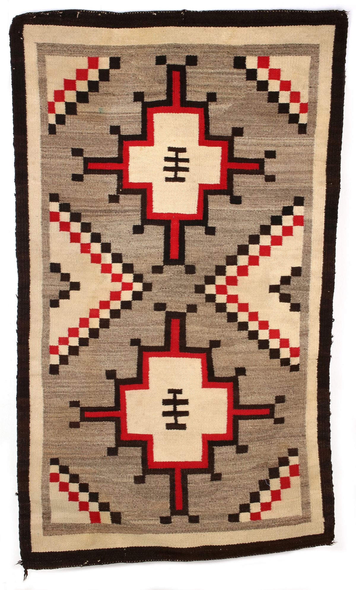 A CIRCA 19 NAVAJO RUG WITH FLOATING MEDALLIONS