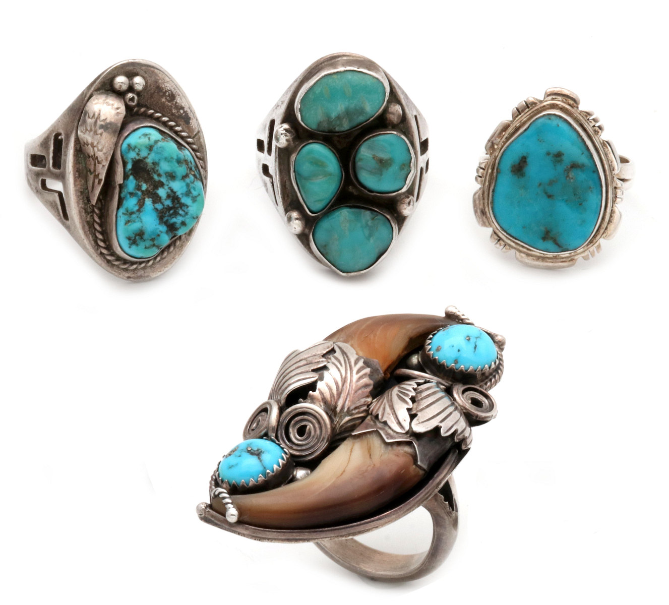 FOUR VINTAGE NAVAJO INDIAN STERLING AND TURQUOISE RINGS