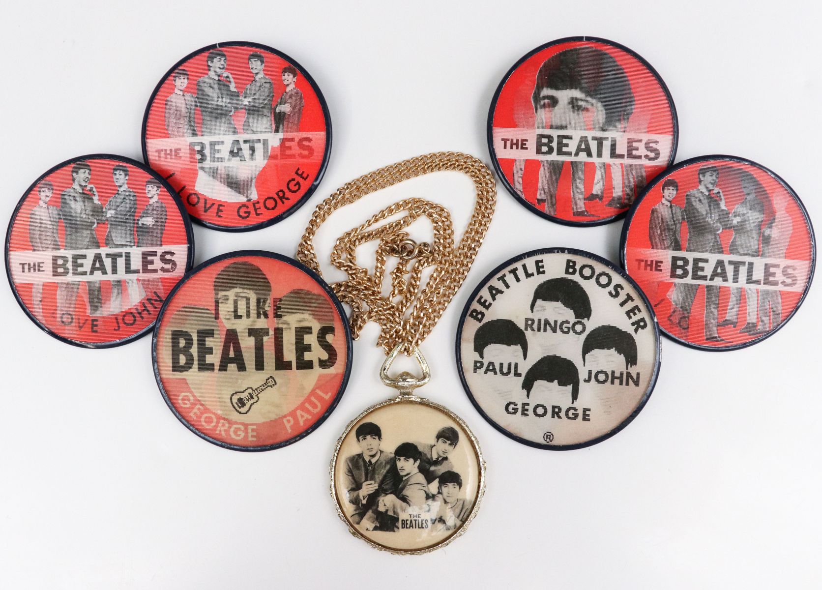A COLLECTION OF SIX ORIGINAL BEATLES FLASHER PINS