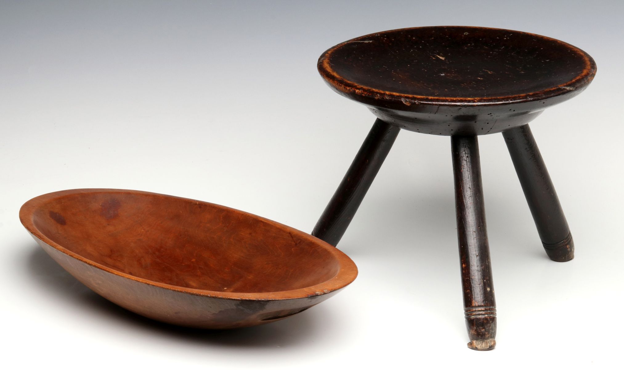 AN EARLY STTOL IN BLACK STAIN WITH PRIMITIVE OVAL BOWL