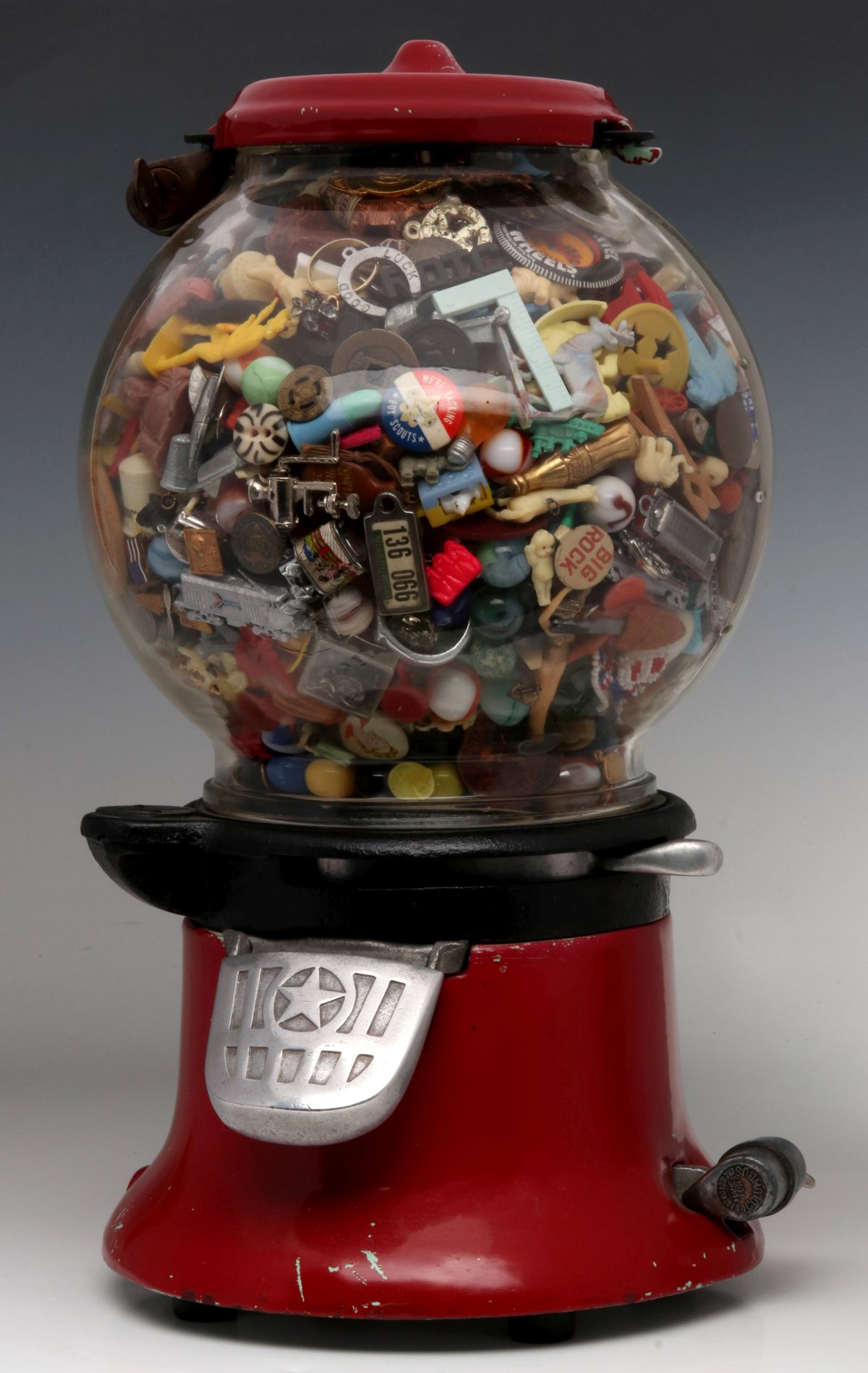 A COLUMBUS MODEL 46 GUMBALL FILLED WITH 1000 COOL ITEMS