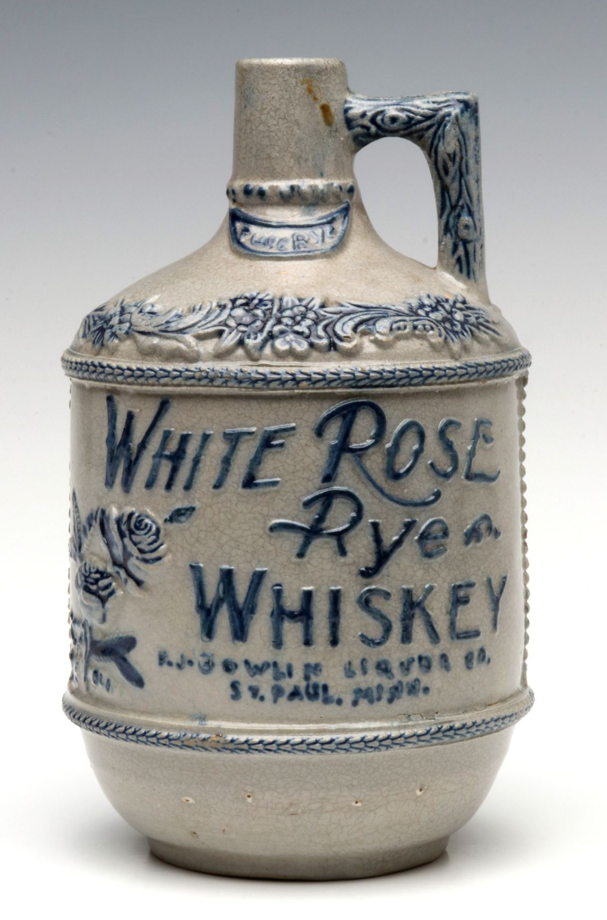 A WHITE ROSE WHISKEY JUG BY WHITE'S STONEWARE UTICA