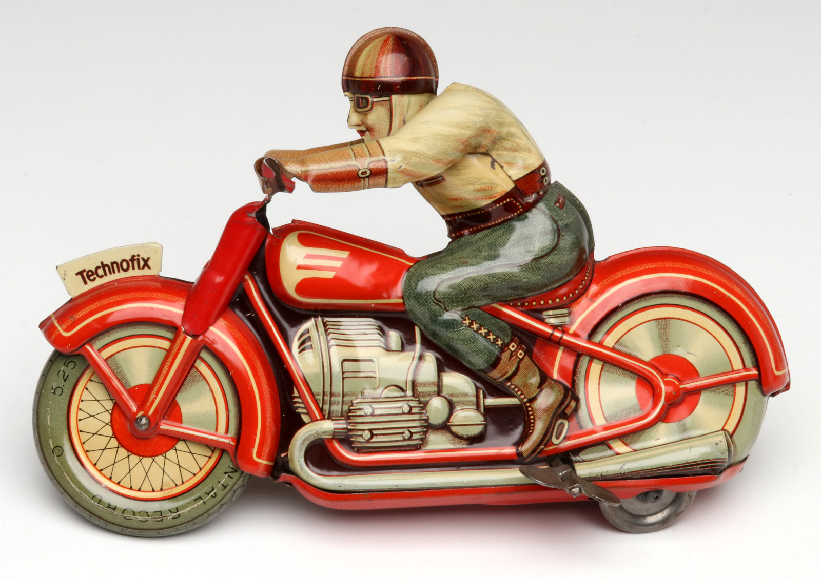 A TECHNOFIX LITHOGRAPHED TIN WIND UP MOTORCYCLE TOY