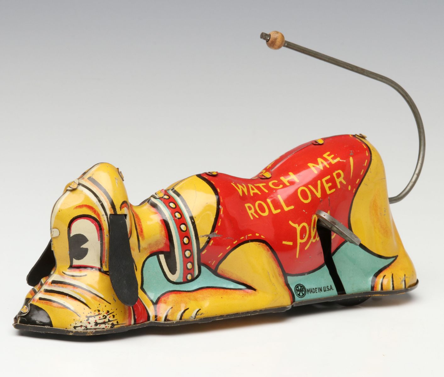 A 1939 LOUIS MARX 'ROLL-OVER PLUTO' TIN WIND-UP TOY