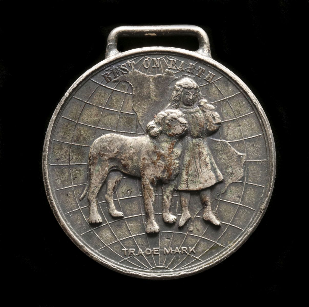 A WELLS SHOES ADVERTISING FOB WITH GIRL AND DOG