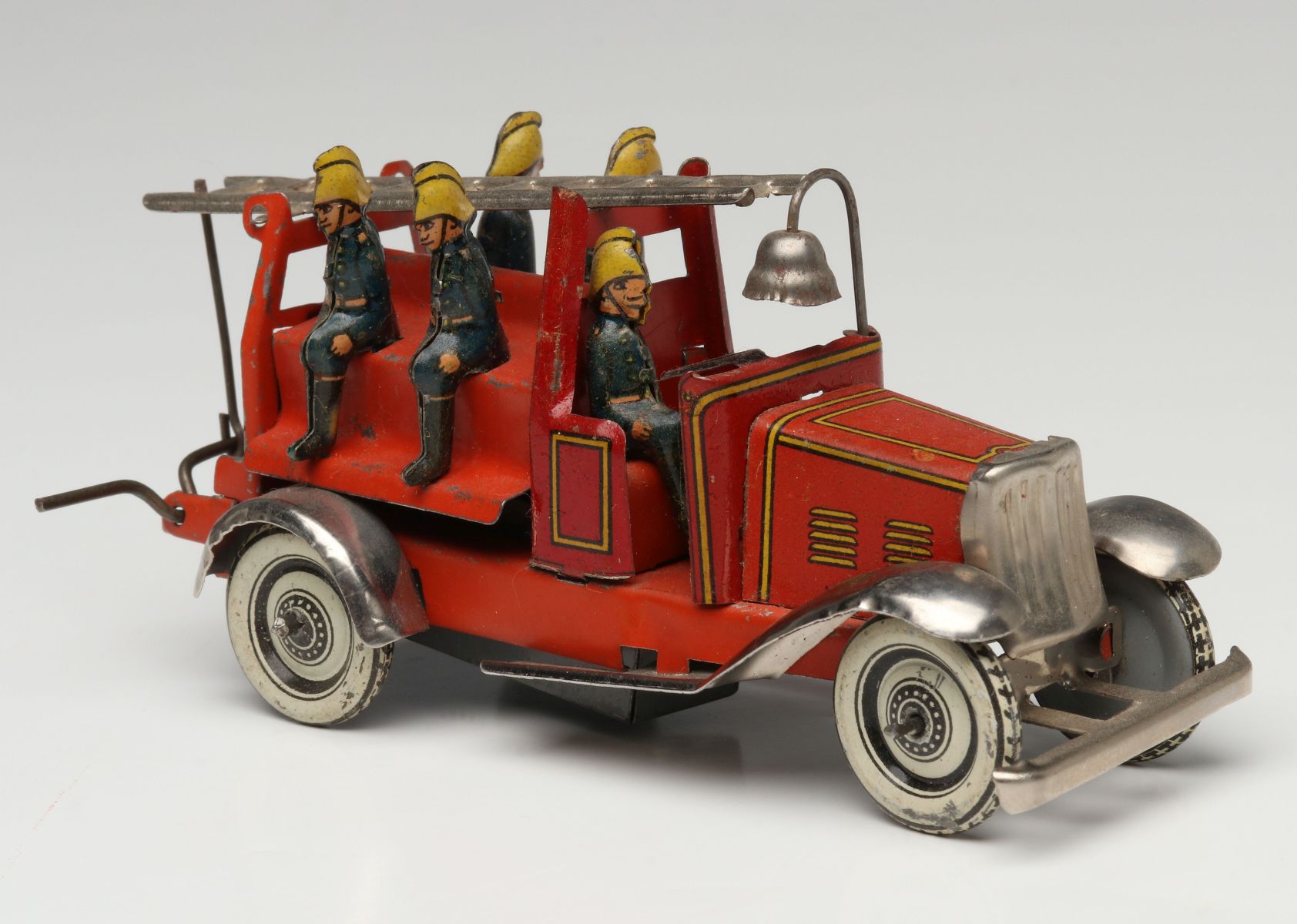 A KELLERMAN LITHOGRAPHED TIN FIRE TRUCK PENNY TOY