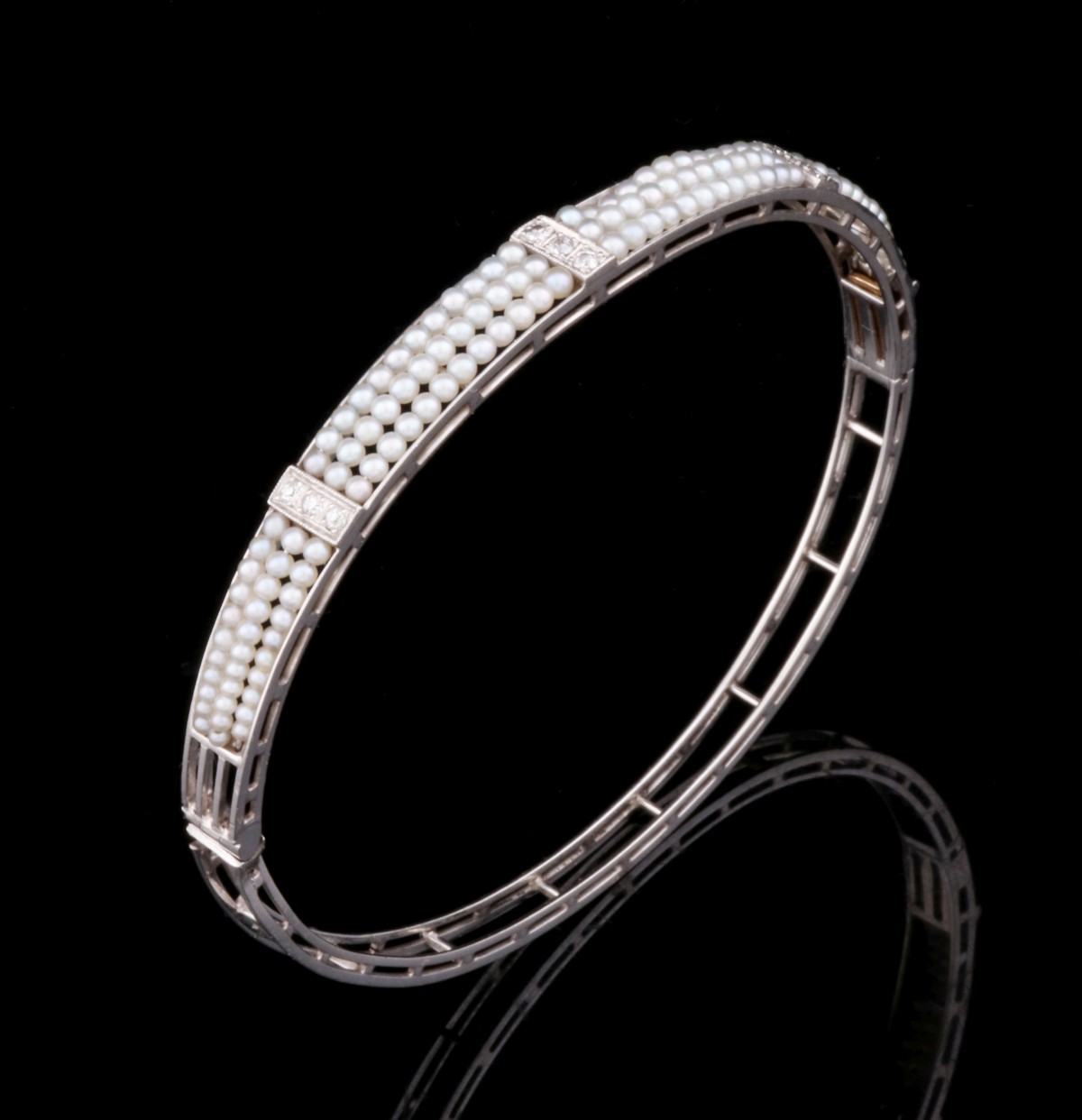 AN ART DECO INFLUENCE PLATINUM BRACELET WITH SEED PEARL
