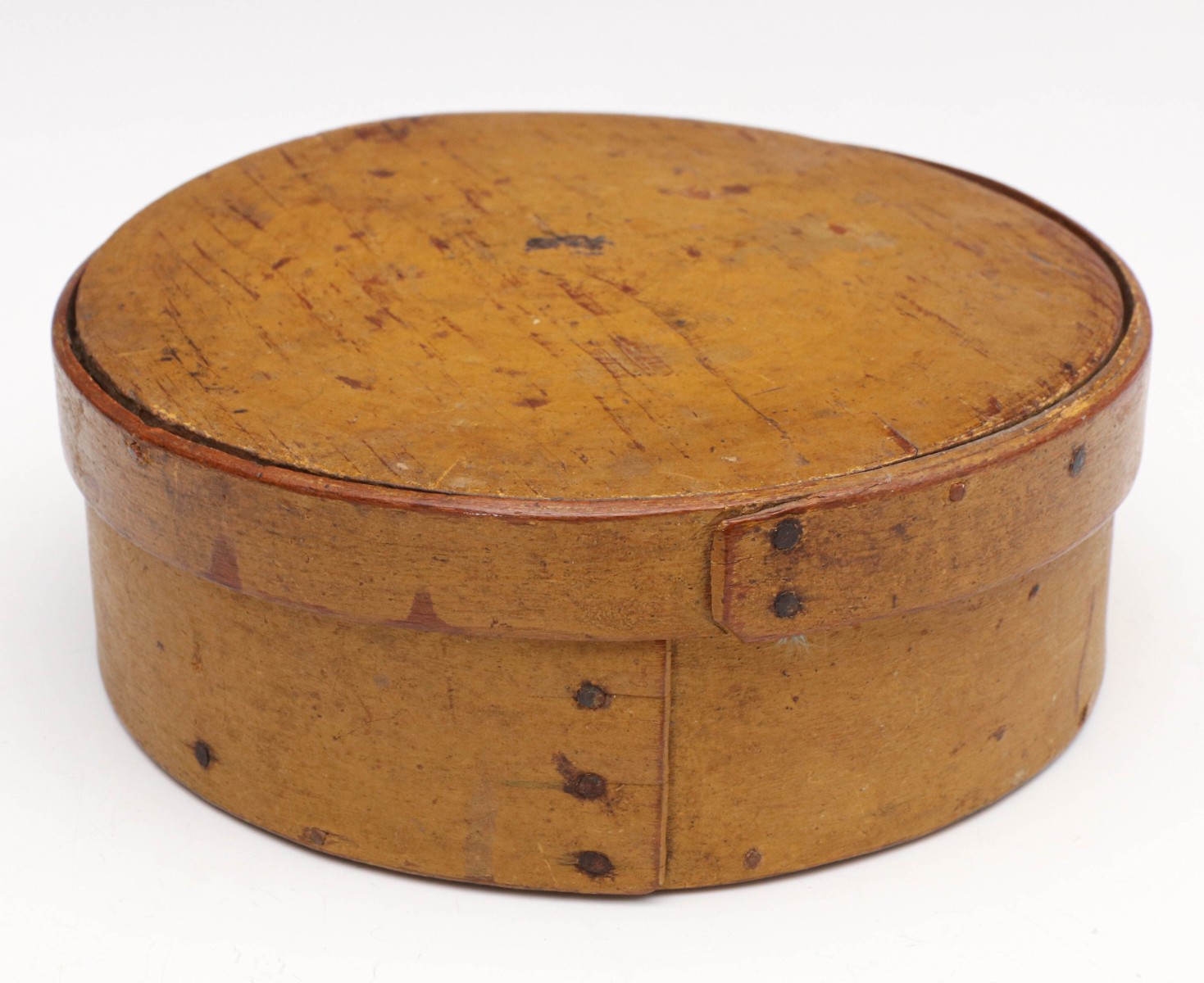 A CIRCULAR 19TH C. BENTWOOD BOX IN OLD YELLOW PAINT