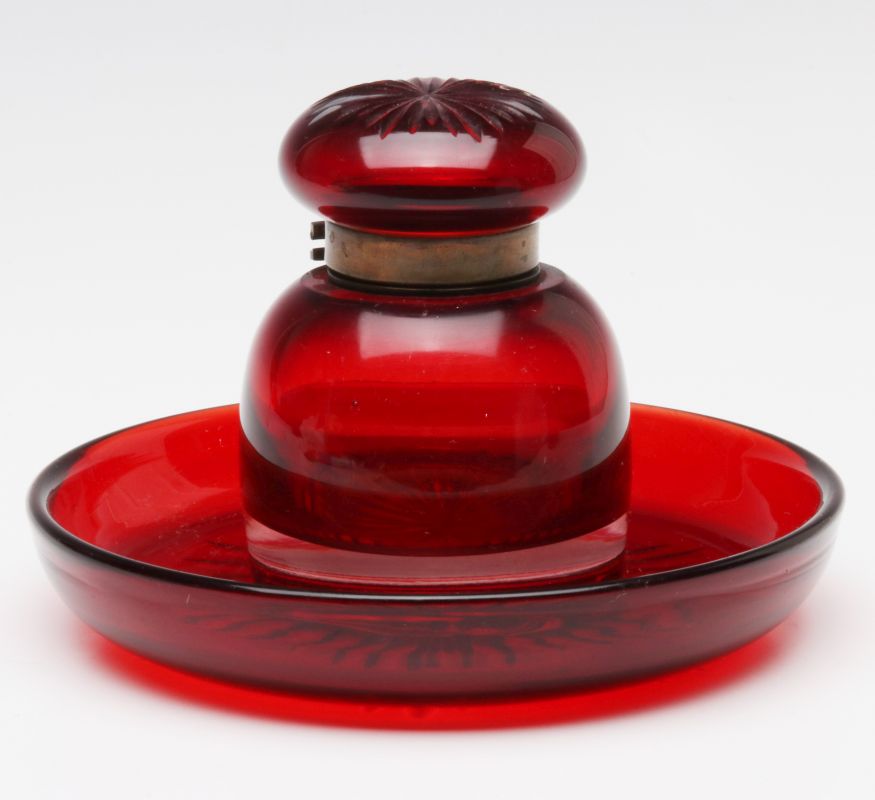 AN ANTIQUE PIGEON BLOOD RED CUT GLASS INK WELL