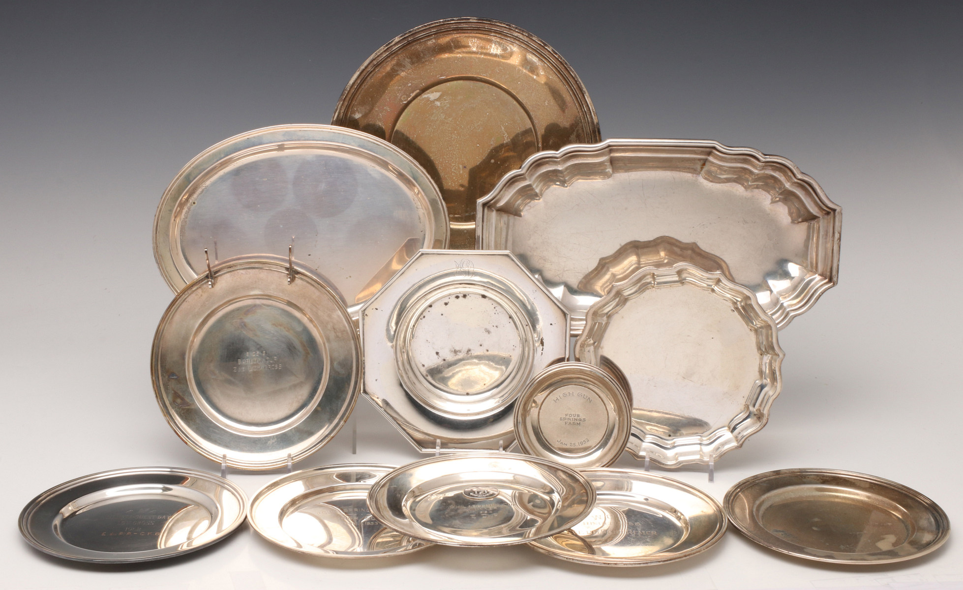 A LARGE GROUP OF STERLING HOLLOWWARE TRAYS AND PLATES