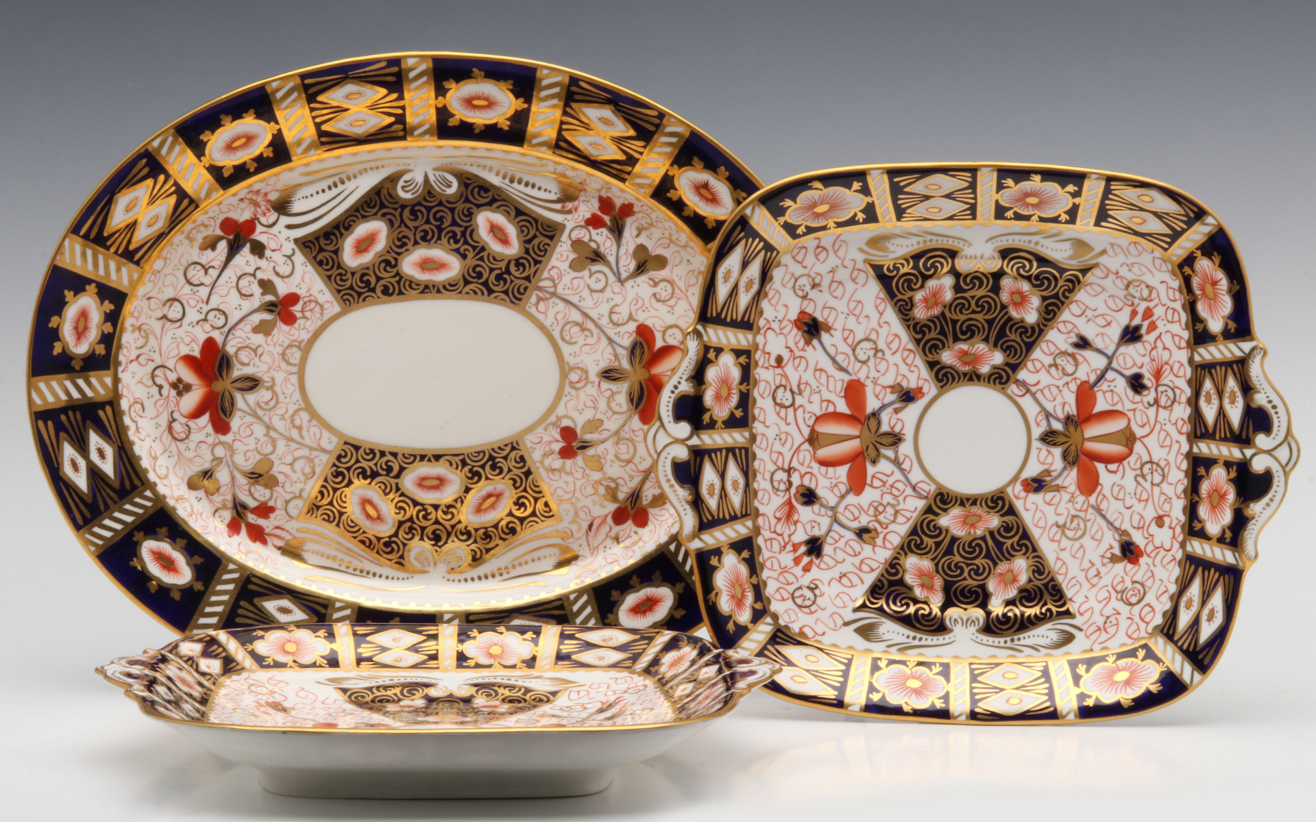 ROYAL CROWN DERBY TWO-HANDLED TRAYS AND SIMILAR PLATTER