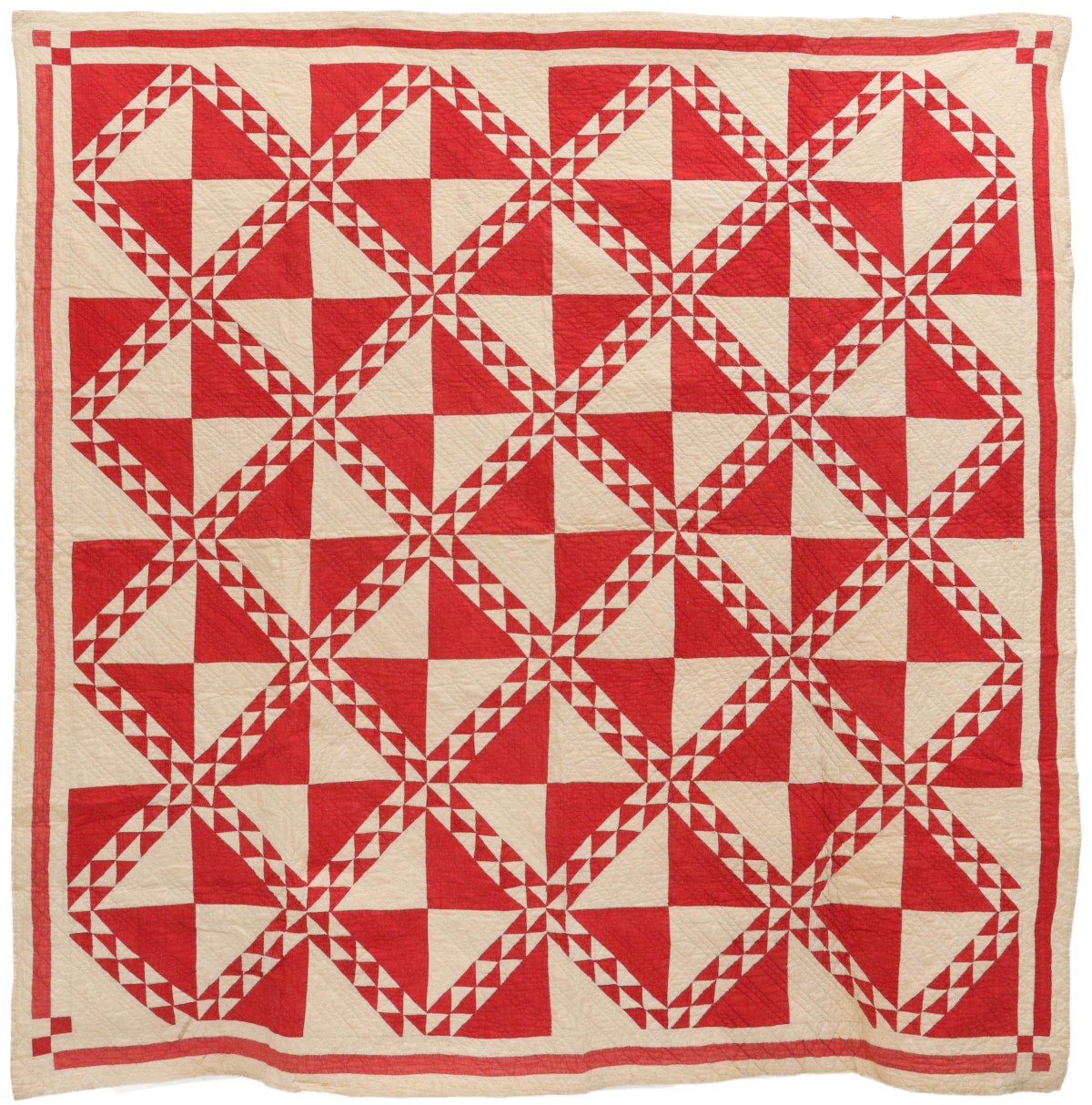 AN ANTIQUE 'LINTON' PATTERN RED AND WHITE QUILT - PLUS