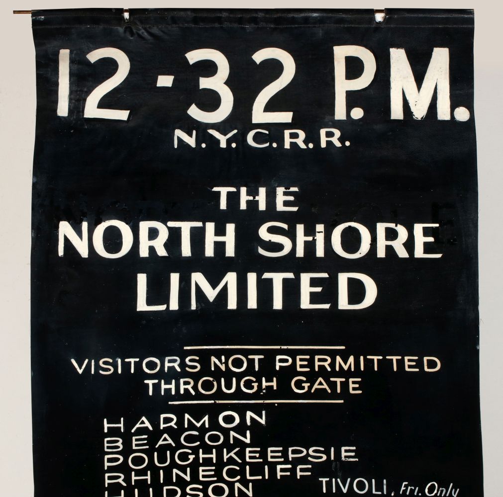 A HAND PAINTED GATE SIGN FOR THE NORTHSHORE LIMITED