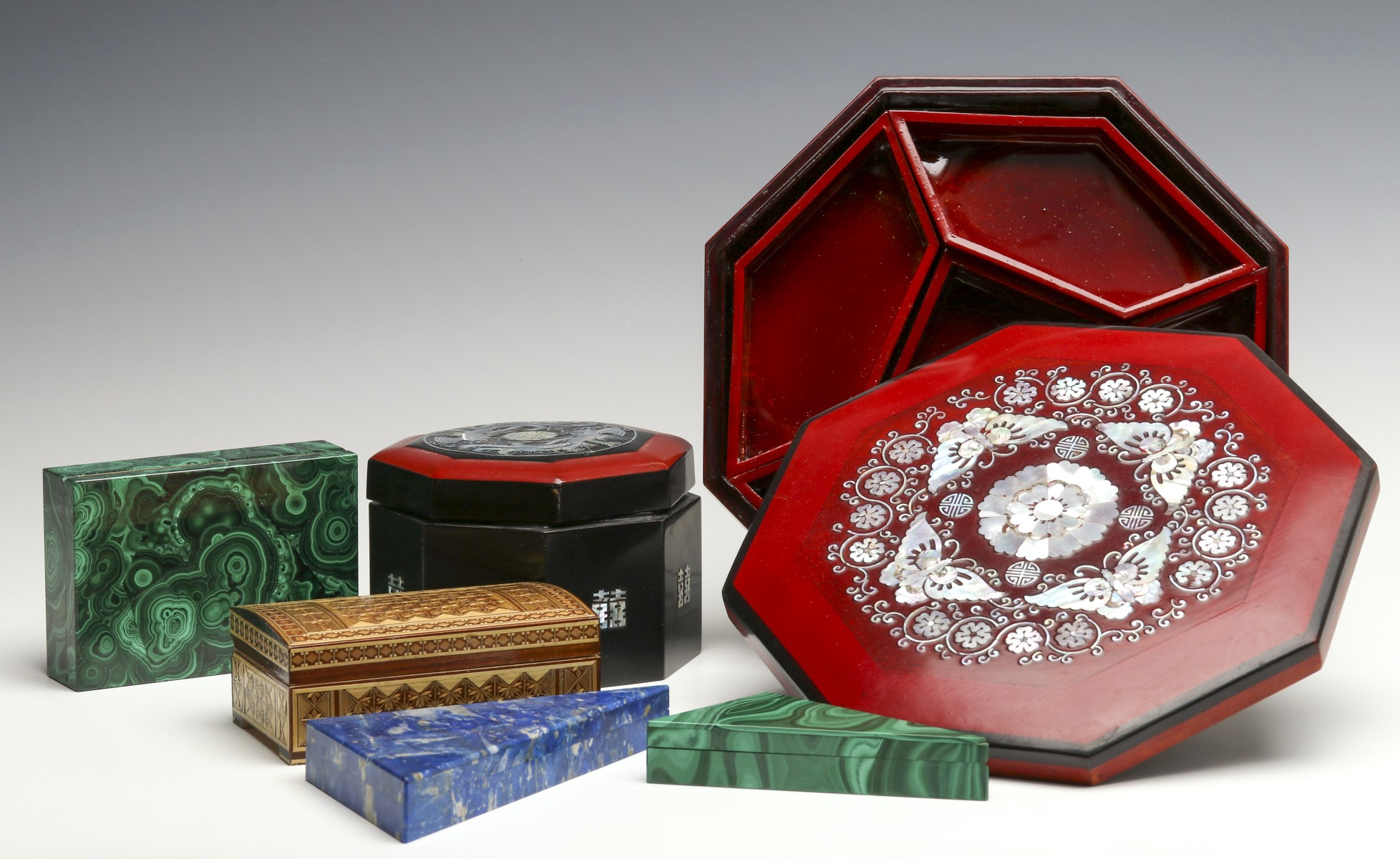 A COLLECTION OF DECORATIVE BOXES AND CONTAINERS