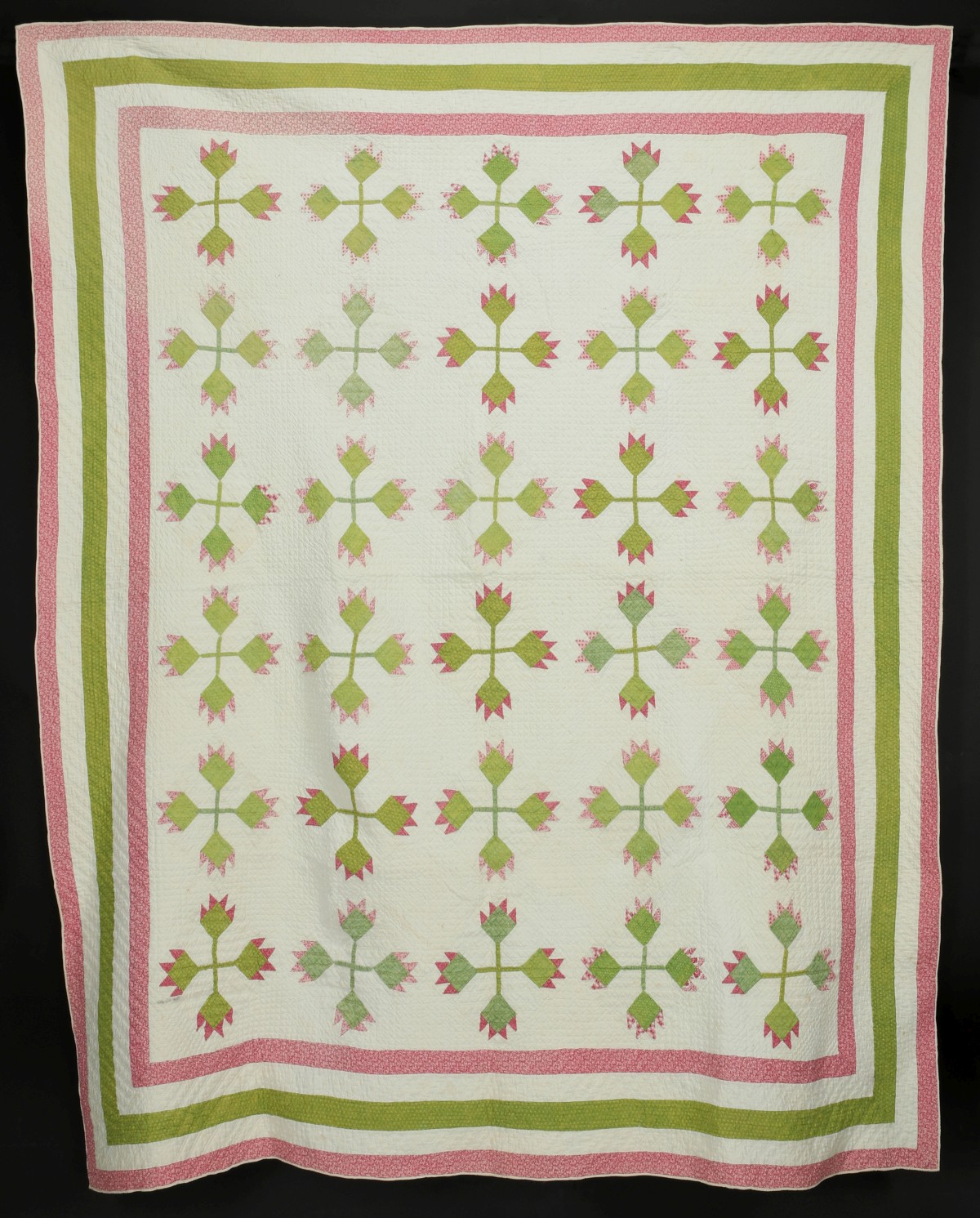 AN ANTIQUE NORTH CAROLINA LILY PATTERN QUILT
