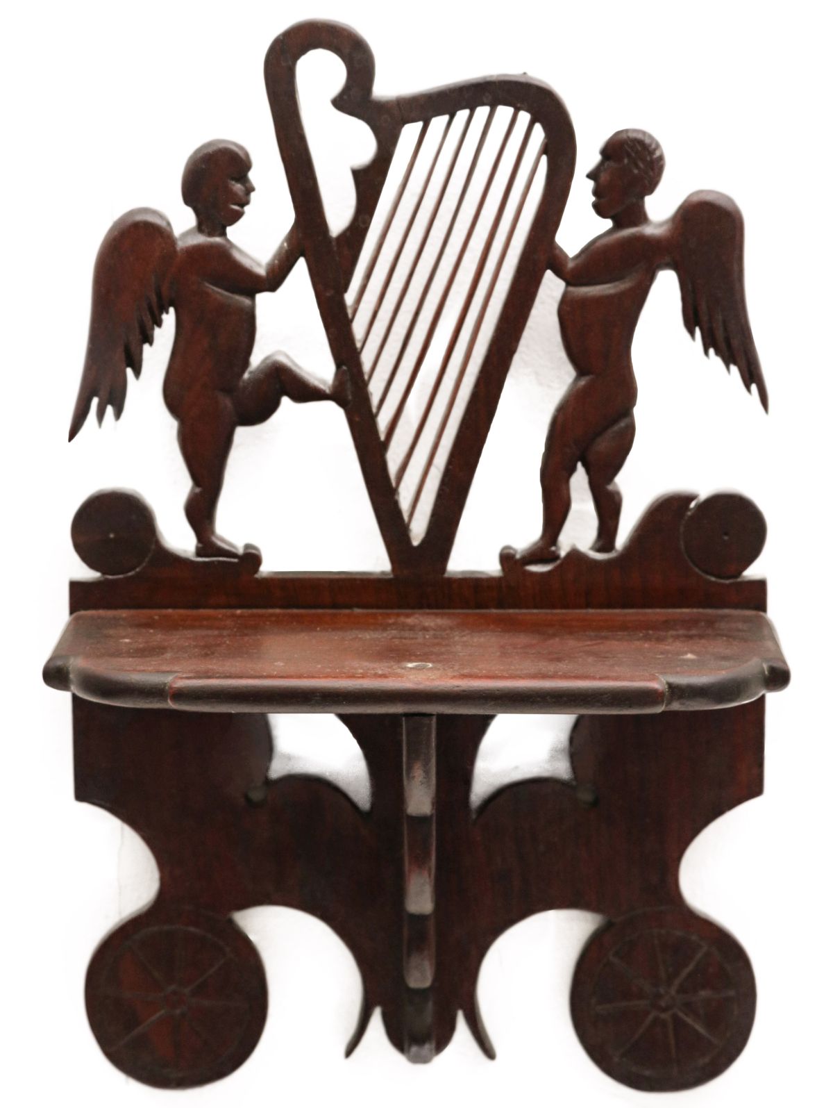 A CARVED FOLK ART SHELF WITH ANGEL AND HARP SILHOUETTE