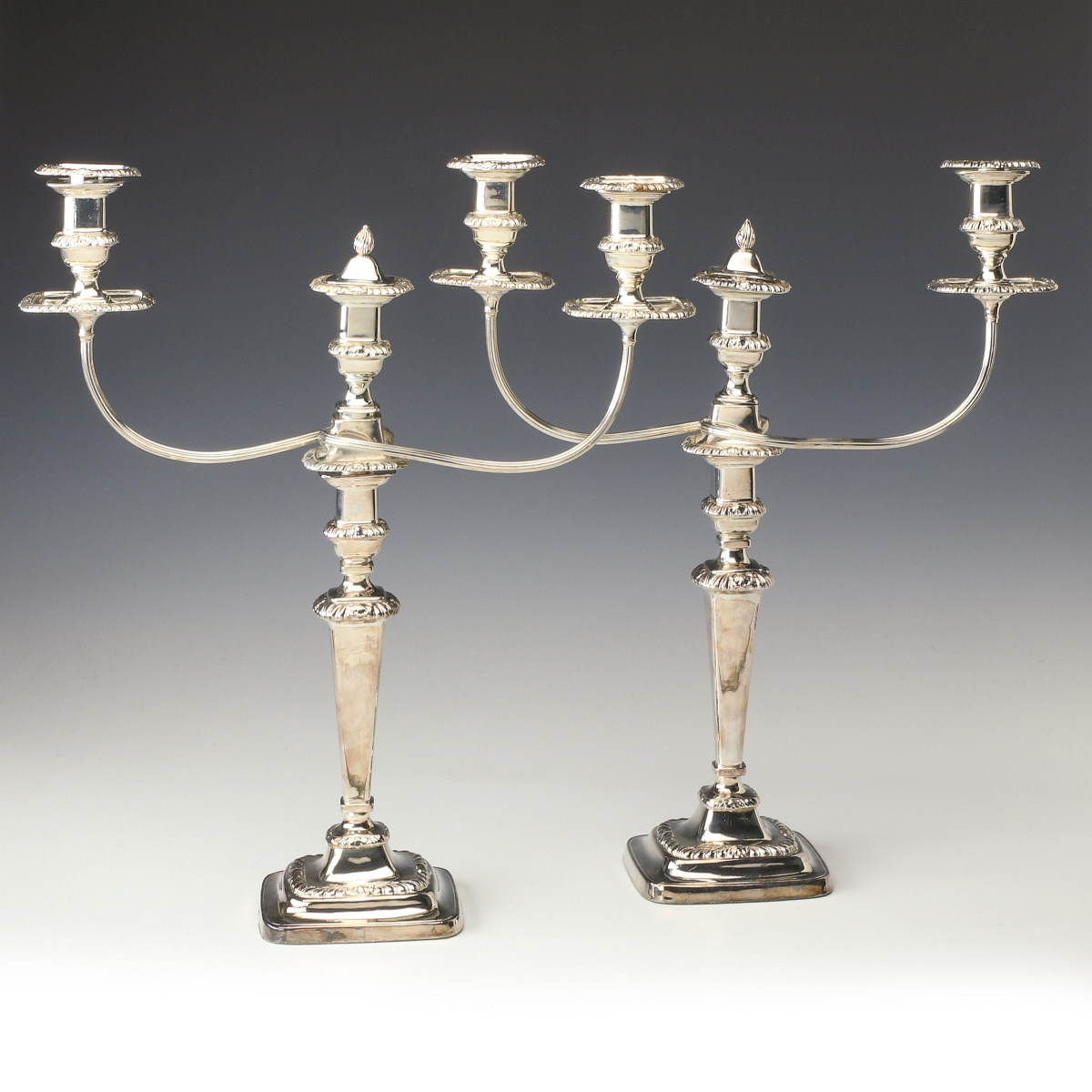 A PAIR OF LARGE GEORGIAN OLD SHEFFIELD PLATE CANDELABRA