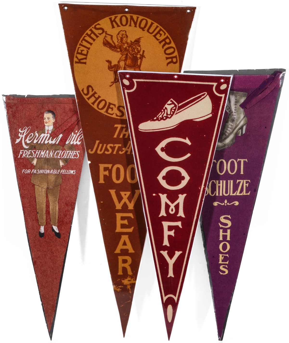 A COLLECTION OF SHOE AND CLOTHING ADVERTISING PENNANTS