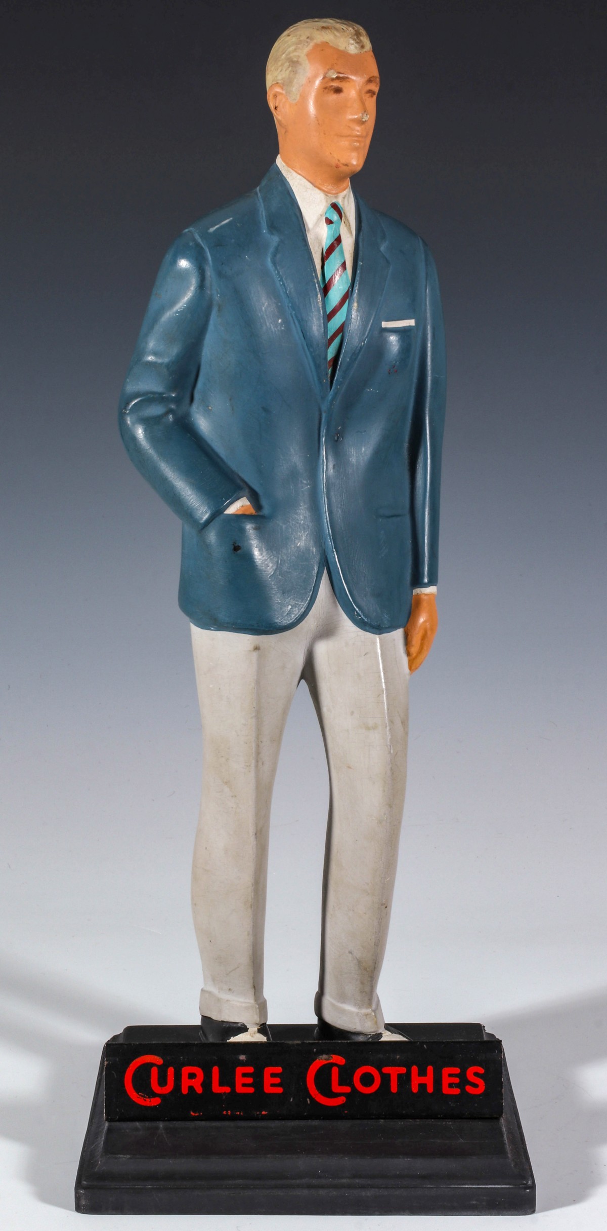 A COUNTER TOP ADVERTISING FIGURE FOR CURLEE CLOTHES