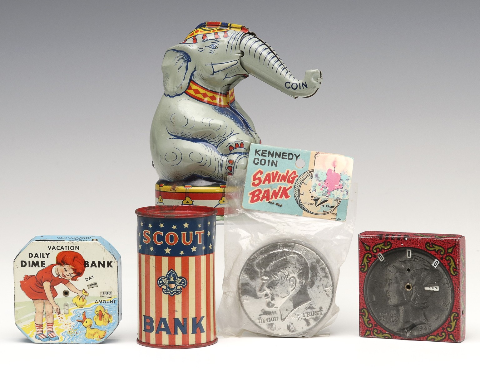 A COLLECTION OF TIN LITHO TOY BANKS