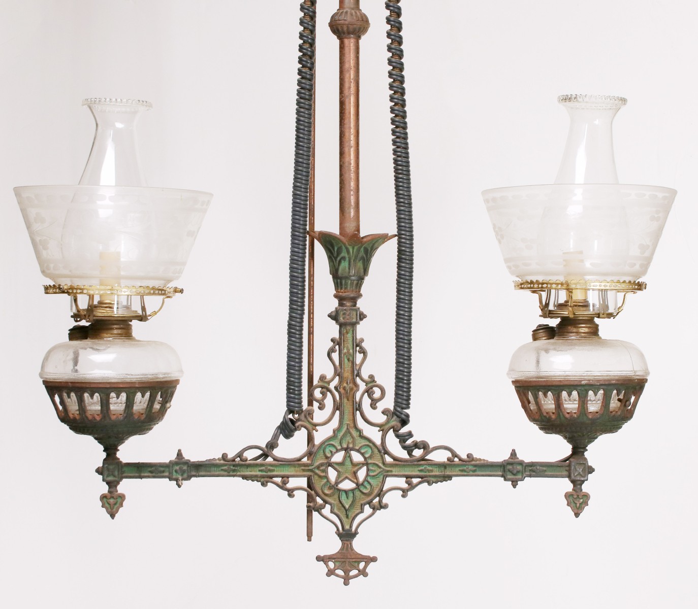 AN ORNATE VICTORIAN CAST IRON TWO ARM CHANDELIER
