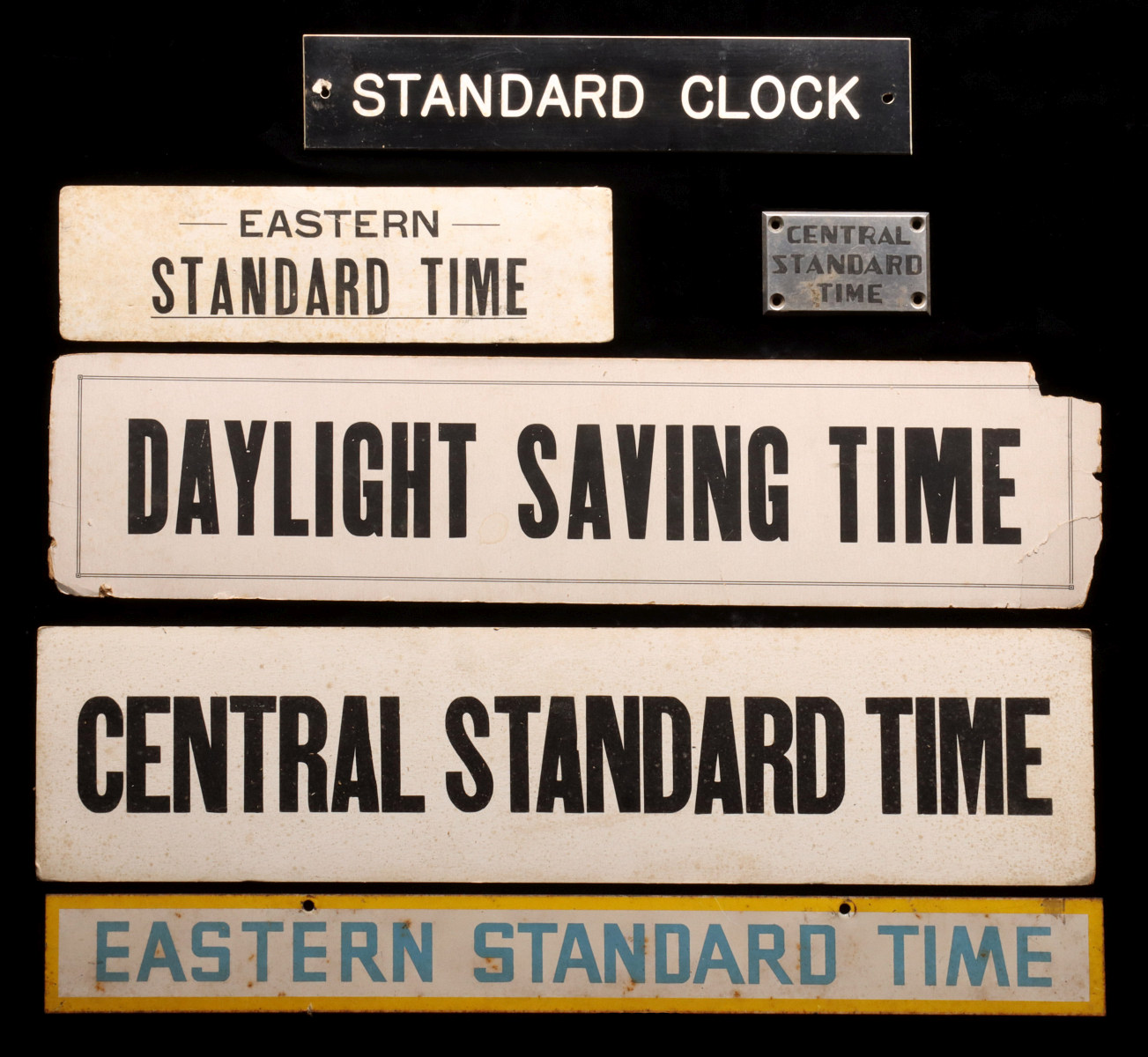 A COLLECTION OF RAILROAD STATION CLOCK PLACARDS