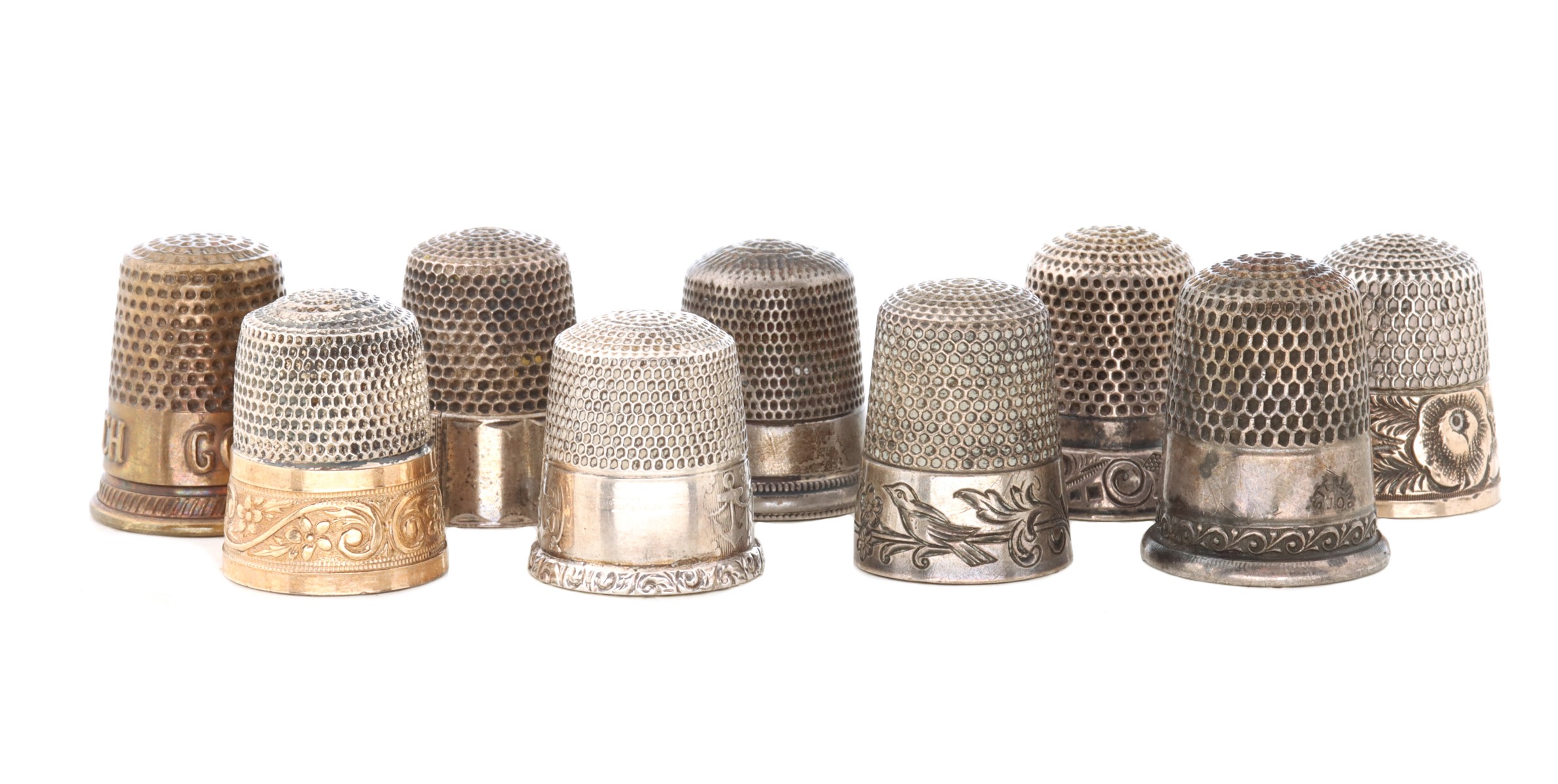 A COLLECTION OF ANTIQUE STERLING SILVER THIMBLES