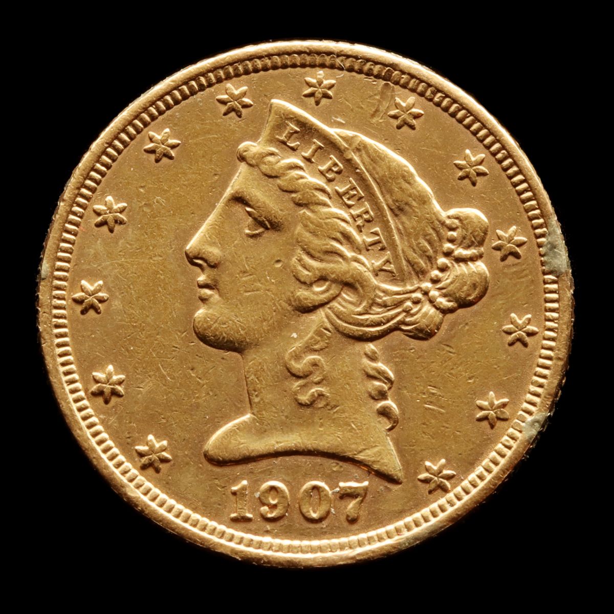 A 1907-D LIBERTY HEAD $5 US GOLD COIN