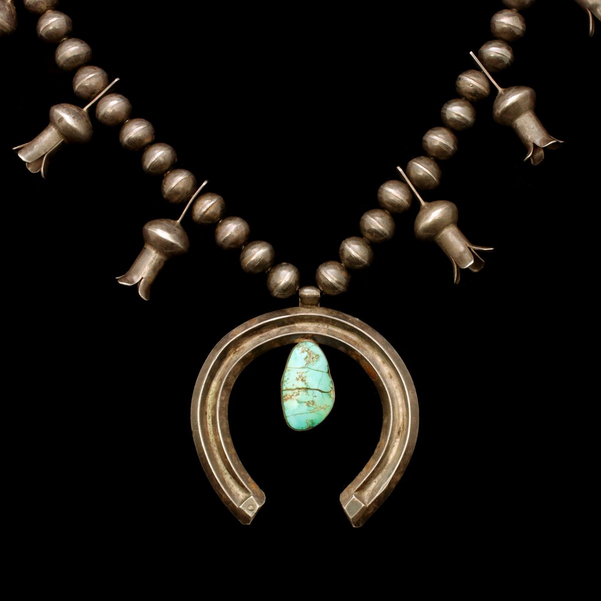 A GOOD NAVAJO SQUASH BLOSSOM NECKLACE WITH TURQUOISE