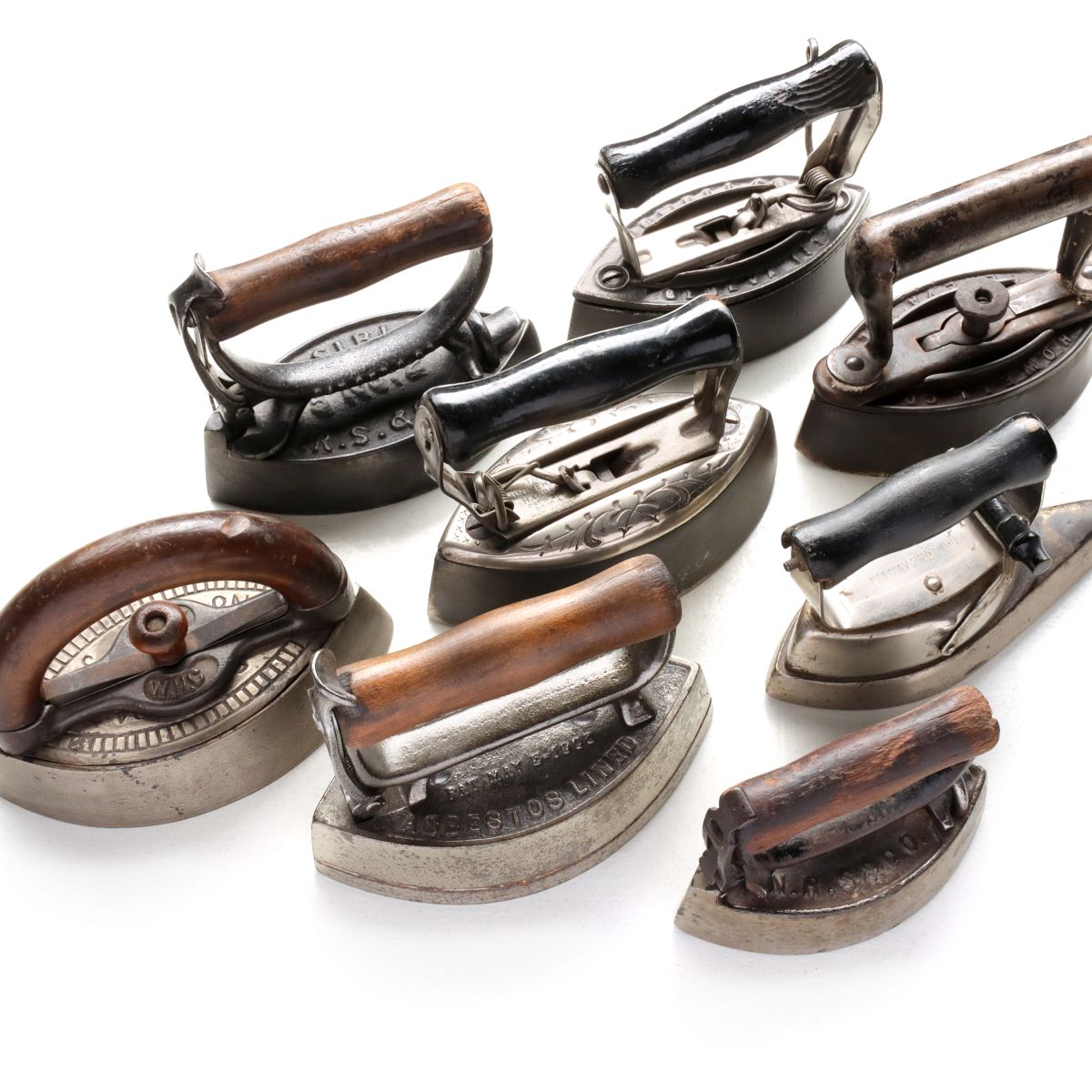 A COLLECTION OF ANTIQUE SAD IRONS
