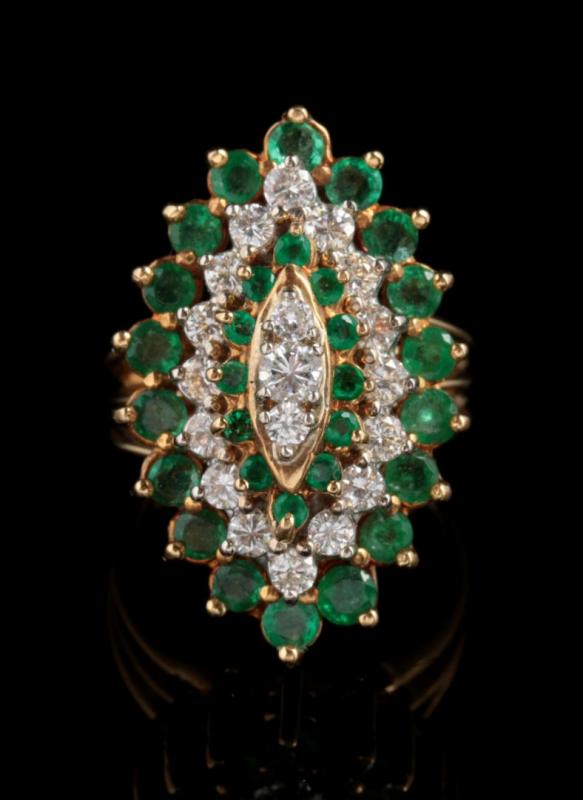 AN 18K GOLD EMERALD AND DIAMOND COCKTAIL RING