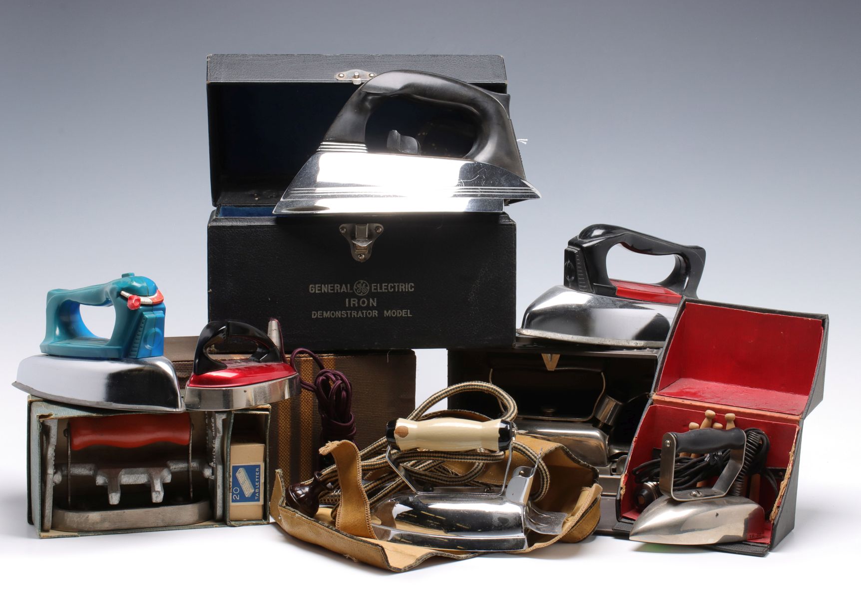 A COLLECTION OF VINTAGE ELECTRIC IRONS