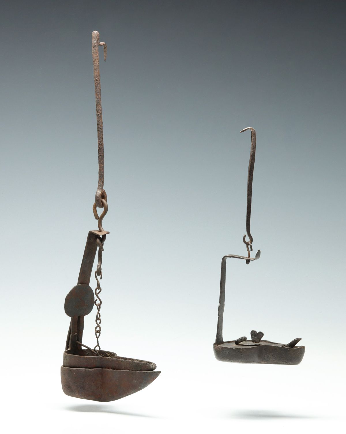 TWO 17TH / 18TH CENTURY IRON FAT OR GREASE LAMPS