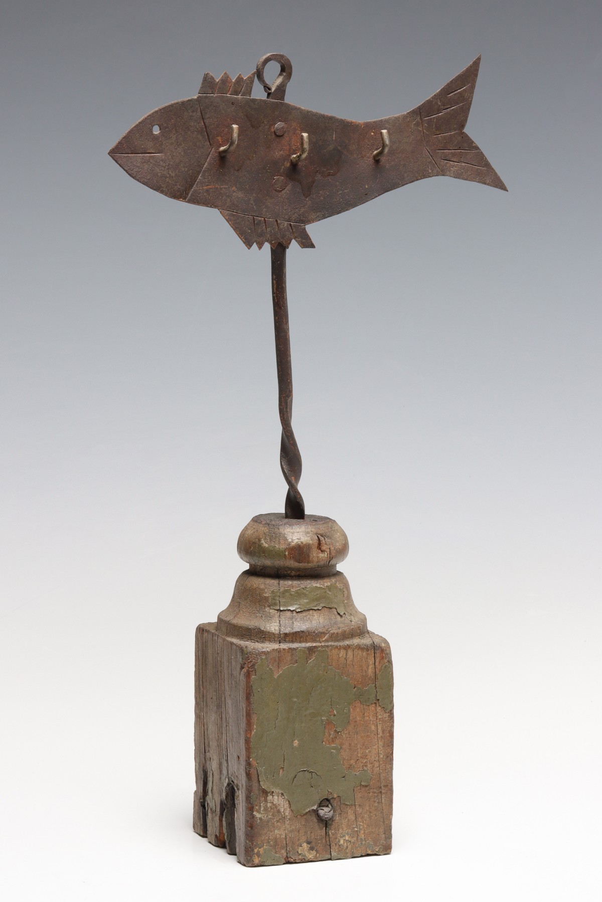 AN EARLY 19TH CENTURY FISH FORM SKEWER HANGER