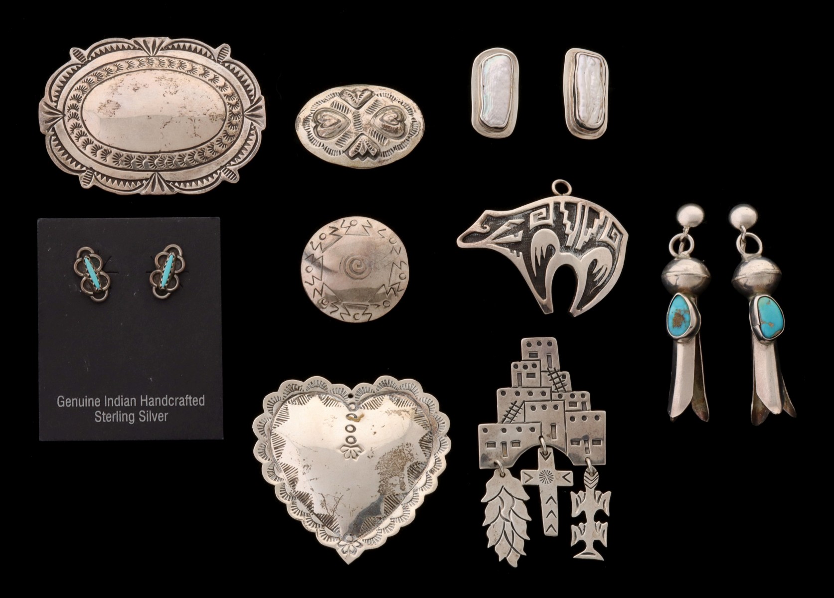 A COLLECTION OF NAVAJO STERLING SILVER JEWELRY