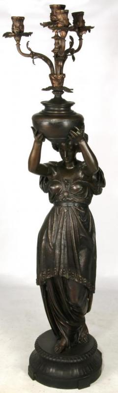 A 67-INCH PATINATED SPELTER FIGURAL LADY CANDELABRUM 