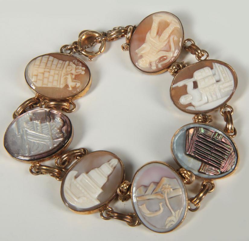 A SHELL CAMEO LINK BRACELET DEPICTING THE SEVEN WONDERS