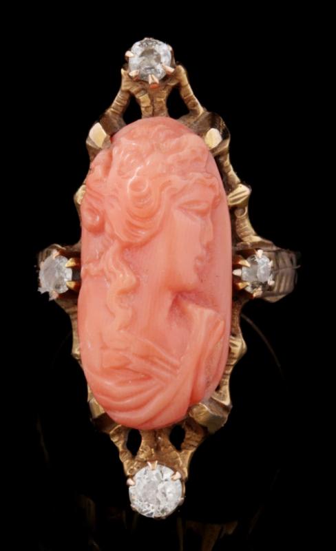 AN ANTIQUE CORAL CAMEO AND DIAMOND RING