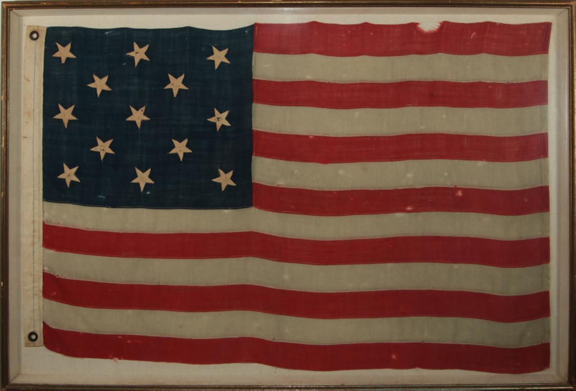 A LATE 19TH CENTURY AMERICAN THIRTEEN STAR FLAG