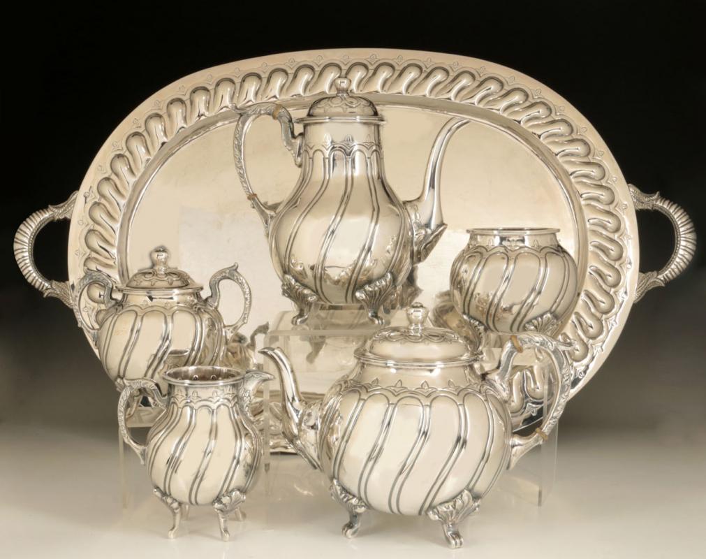 A MEXICAN STERLING SILVER TEA SET OF TRADITIONAL DESIGN