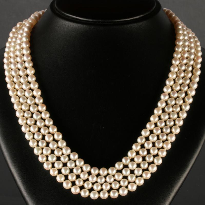 AN 86-INCH CULTURED PEARL ROPE STRAND WITH GOLD CLASP 